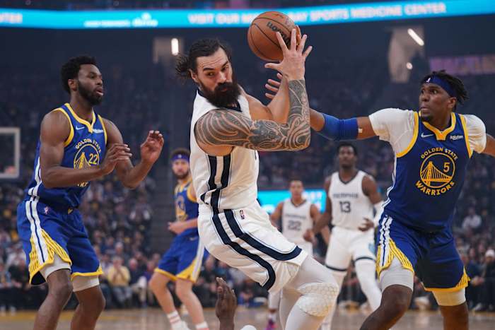 May 13, 2022; San Francisco, California, USA; Memphis Grizzlies center Steven Adams (4) holds onto a rebound next to Golden State Warriors forward Andrew Wiggins (22) and forward Kevon Looney (5) in the first quarter during game six of the second round for the 2022 NBA playoffs at Chase Center. Mandatory Credit: Cary Edmondson-USA TODAY Sports